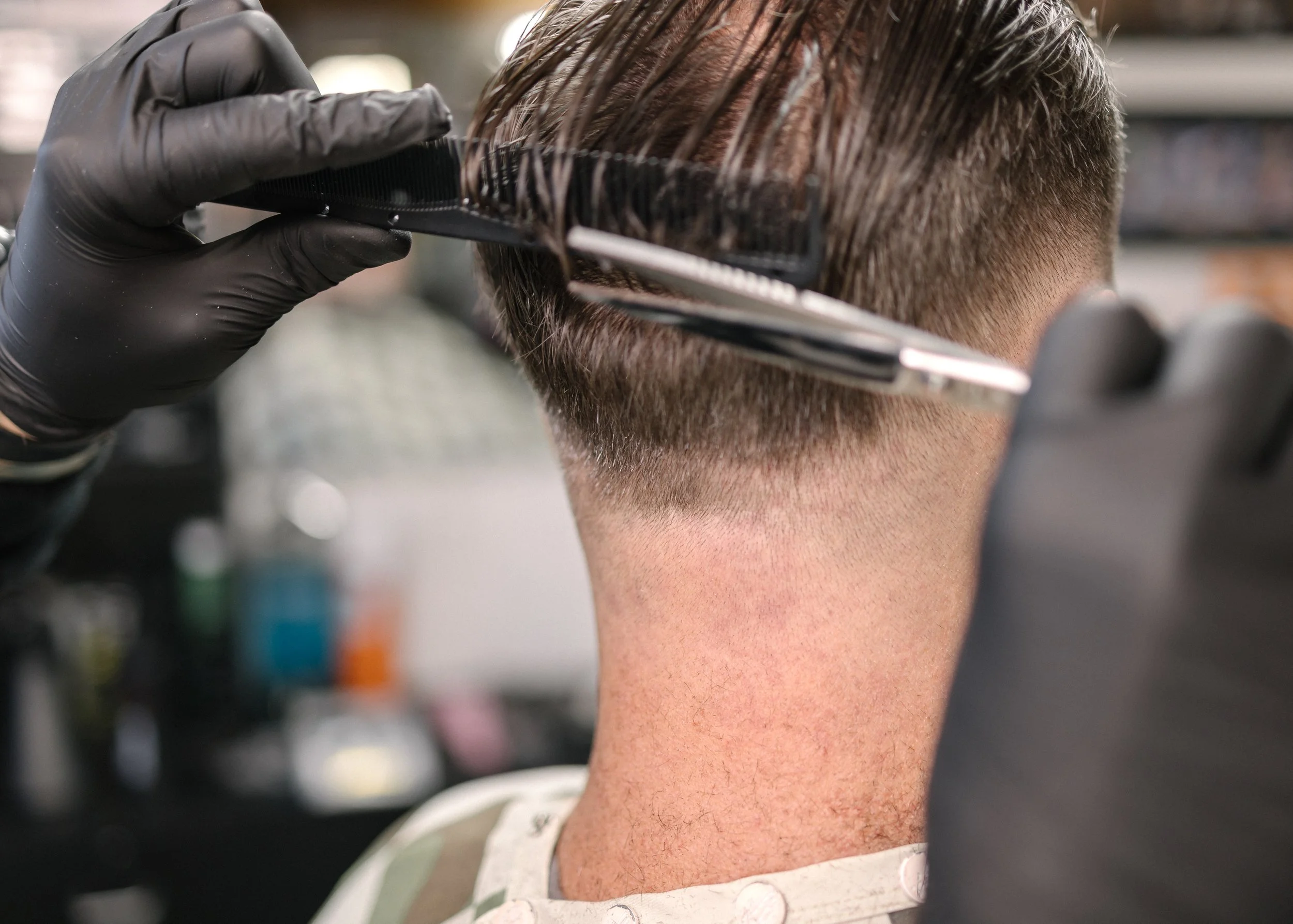 A precision haircut in progress at Barbiere